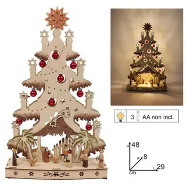 Christmas tree in wood with nativity scene and light