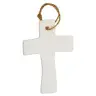 Croix en porcelaine blanche avec rameaux 9.5 x 6.5 cm